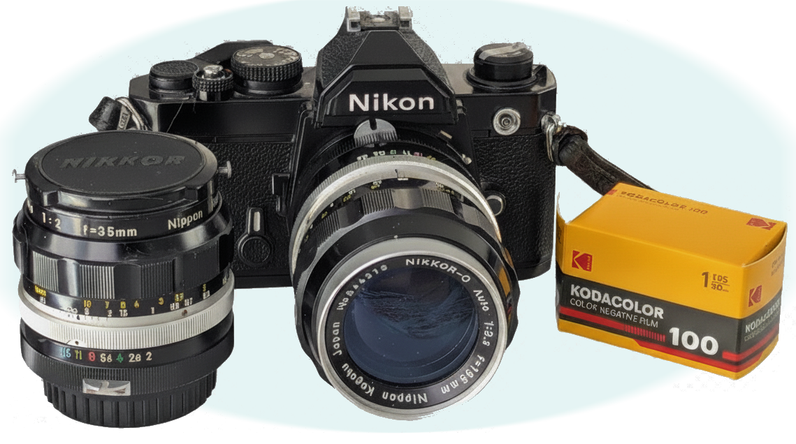 Black Nikon FM camera, Nikkor O 35mm f1:2, Nikkor O 135mm f1:3.5, and Yellow Kodak Kodacolor 100 film box